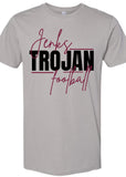 A light gray crewneck t-shirt featuring a graphic print on the front with the words 'Jerks TROJAN football' in black and maroon script. 